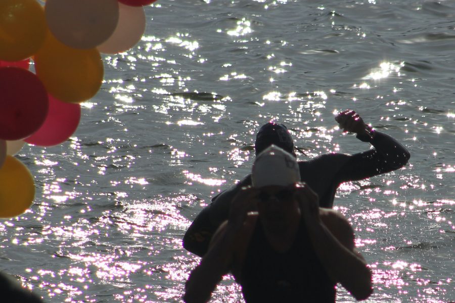 Two men coming out of water in triathlon